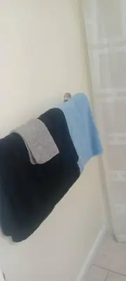 a towel hanging on a wall in a bathroom at The place to relax in Schenectady