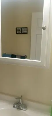 a mirror above a sink in a bathroom at The place to relax in Schenectady