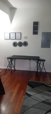 a ping pong table in a room with a table at The place to relax in Schenectady