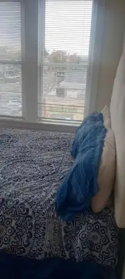 a person laying on a bed in a bedroom at the rest spot in Schenectady