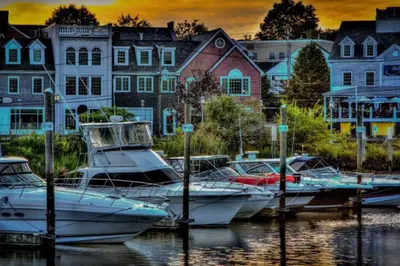 a group of boats are docked in a harbor at Bobby's Beach Bungalow in Milford