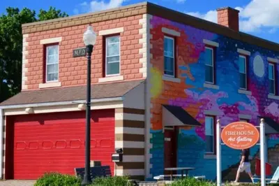 a building with a colorful mural on the side of it at Bobby's Beach Bungalow in Milford