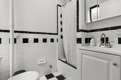 a bathroom with a toilet and a sink at 89-3FS Newly Furnished 2br 1bath UES in New York