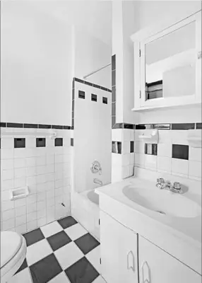 a white bathroom with a sink and a toilet at 89-3FS Newly Furnished 2br 1bath UES in New York