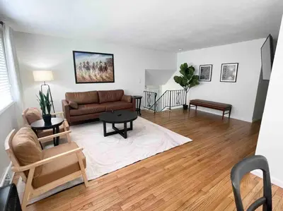 a living room with a couch and a table at 2023 Remodeled 4bed/2bath Home! in Gansevoort