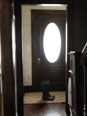 a door with a round window and a rubber boot at Designer Home, Hot Tub, Private Yard, & Projector in Hudson