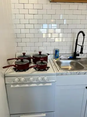 two pots sitting on top of a stove in a kitchen at 1BR Apt 5mins to Proctors in Schenectady