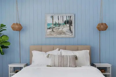 a bed with white sheets and pillows in a bedroom at Game Room+Hot Tub+Pool+King Beds+More in Gansevoort