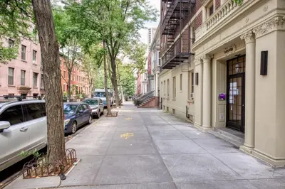 a city street with cars parked on the sidewalk at Brooklyn Heights 2br w elevator wd NYC-1066 in Brooklyn