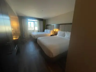 a hotel room with two beds and a window at Holiday Inn Express Long Island City E - New York by IHG in Queens