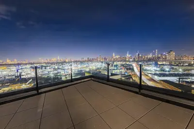 a view of a city skyline at night at Holiday Inn Express Long Island City E - New York by IHG in Queens