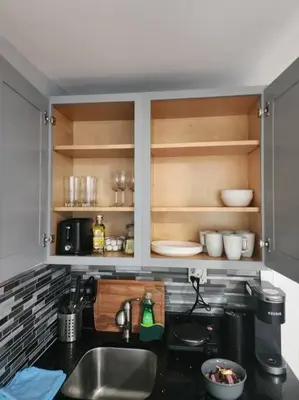 a kitchen with a sink and a counter top at Cozy studio in a lovely area in Forest Hills