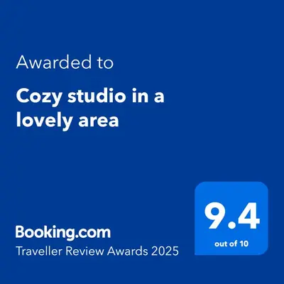 a screenshot of a phone with the text awarded to cozy studio in a loyalty area at Cozy studio in a lovely area in Forest Hills