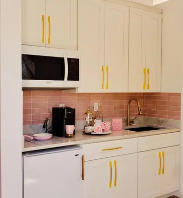 a kitchen with white cabinets and a microwave at Unique Escapes - Rosé All Day Geodome in Monticello