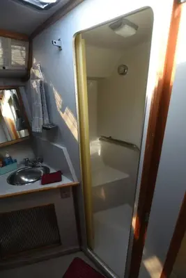 a small bathroom with a shower and a sink at Beautiful Yacht on Catskill Creek in Catskill