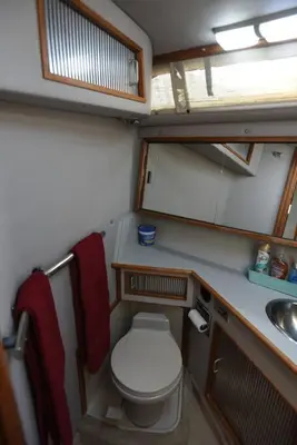 a small bathroom with a toilet and a sink at Beautiful Yacht on Catskill Creek in Catskill