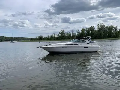 a white boat in the water on a lake at Charming Yacht on Catskill Creek in Catskill