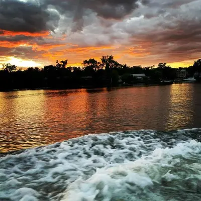 a boat in a body of water at sunset at Charming Yacht on Catskill Creek in Catskill