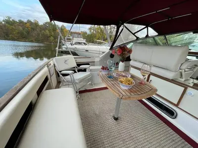 a table and chairs on a boat in the water at Private Yacht on Catskill Creek in Catskill