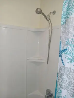 a shower in a bathroom with a shower curtain at comfy cozy roomy in Schenectady