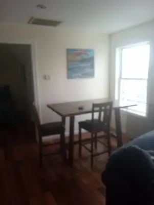 a dining room table and chairs in a room at a nice one bedroom free parking in Schenectady
