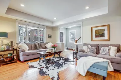 a living room with two couches and a table at Elegant Saratoga Springs Stay Walk to Town, Track in Saratoga Springs