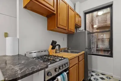 a kitchen with a stove and a sink at Cozy 1BR in the Upper East Side in New York