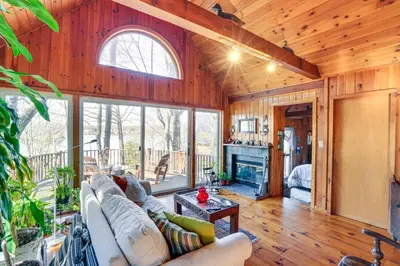 a living room with a couch and a fireplace at Ski, Sip and Snuggle Cozy Catskills Gem with Views! in Athens
