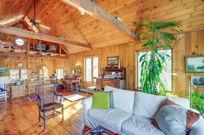 a living room with a couch and a table at Ski, Sip and Snuggle Cozy Catskills Gem with Views! in Athens