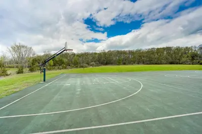 an empty basketball court with a basketball hoop at Ski, Sip and Snuggle Cozy Catskills Gem with Views! in Athens