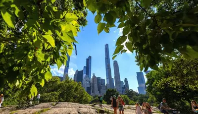 people standing in a park with a city in the background at Apartment near Times Square UWS Manhattan in New York