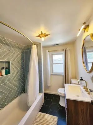 a bathroom with a sink and a toilet at Chic Spacious Apt Near Attractions/Food/EWR/NYC in West Orange