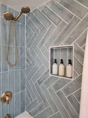 a bathroom with three soap bottles on a tiled wall at Chic Spacious Apt Near Attractions/Food/EWR/NYC in West Orange