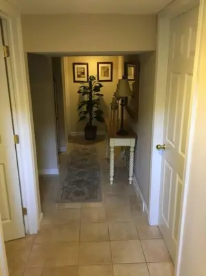 a hallway with a table and a potted plant at Shelton Affordable Gateway in Shelton
