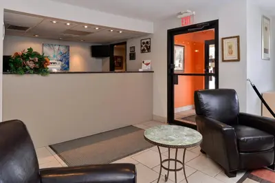 a waiting room with two chairs and a table at Americas Best Value Inn New Paltz in New Paltz