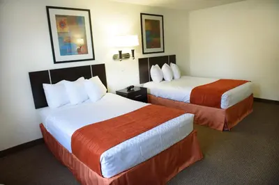 a hotel room with two beds in a room at Americas Best Value Inn New Paltz in New Paltz