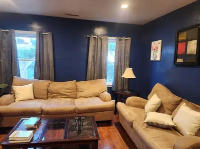 a living room with a couch and a table at spacious and indulging in Meriden