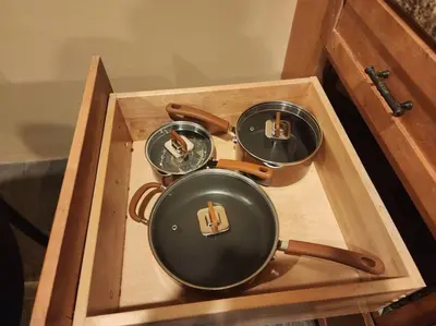 a wooden tray with three pans in a wooden box at spacious and indulging in Meriden