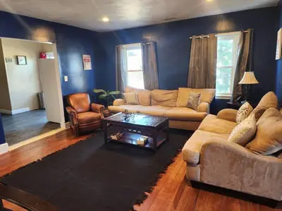 a living room with a couch and a coffee table at spacious and indulging in Meriden