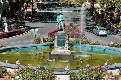 a statue in the middle of a fountain at The Subterranean Haven in Mount Vernon