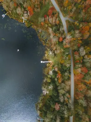 an aerial view of a lake with a boat in it at Lakefront Log Cabin, Private Lake Access w/Peloton in Livingston Manor