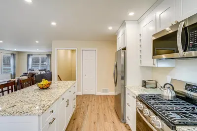 a kitchen with white cabinets and a counter top at Catskills Winter Getaway with Game Room in East Durham