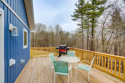 a grill on a deck with a table and chairs at Catskills Winter Getaway with Game Room in East Durham