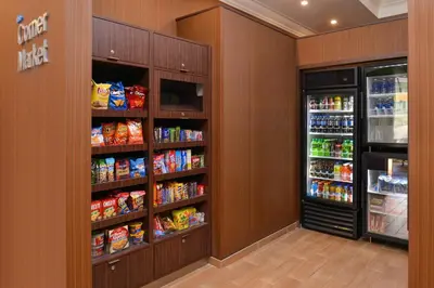 a walk in pantry with two large refrigerators and a refrigerator at Fairfield Inn & Suites by Marriott Albany Downtown in Albany