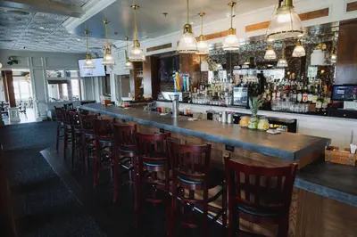 a bar with a bunch of bar stools at Danfords Hotel & Marina in Port Jefferson Station