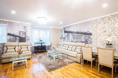 a living room with a couch and a table at Modern Comfort in Brooklyn in Brooklyn