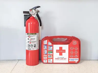 a red fire hydrant next to a fire extinguisher at Spacious Getaway by Wooster Square! in New Haven