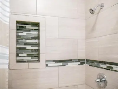 a shower with a glass shelf in a bathroom at Spacious Getaway by Wooster Square! in New Haven
