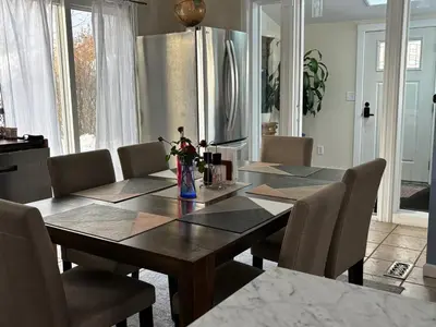 a dining room with a wooden table and chairs at Country House in Catskills in Saugerties