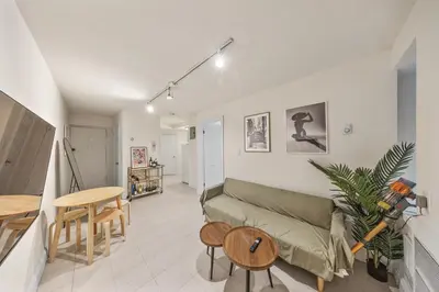 a living room with a couch and a table at Oasis Apartment in the Heart of Union Square Downtown Manhattan in New York